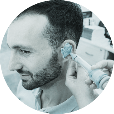 Man getting fitted for custom hearing aids