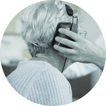 Mature woman getting hearing aid test at Best Life Hearing in Wallingford, CT